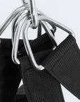 Black straps with metal rings for punching bag suspension.