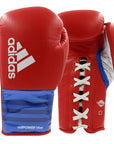 Pair of red adidas boxing gloves.