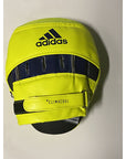 Yellow and black hat resembling Adidas punch mitt for boxing training.