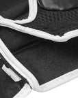 Close-up of a black and white boxing glove for grappling.