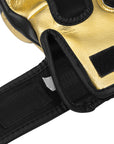 Close-up of GRAPPLING 350 boxing glove in white, gold, black, size L.
