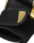 Close-up of a GRAPPLING 350 boxing glove in white and gold.