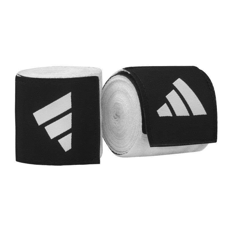 Pair of black and white boxing hand wraps in a roll.