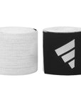 Close-up of two rolled boxing hand wraps.