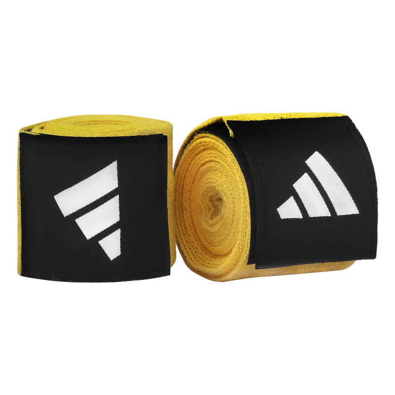 Pair of yellow and black boxing hand wraps in a roll.