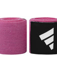 Close-up of pink and black boxing hand wrap in a roll.