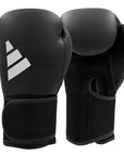 Black boxing gloves with a logo on a white background