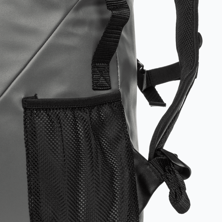 Close-up view of a grey backpack, showing texture detail.