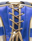 Close-up of a boxing glove on a plain background.
