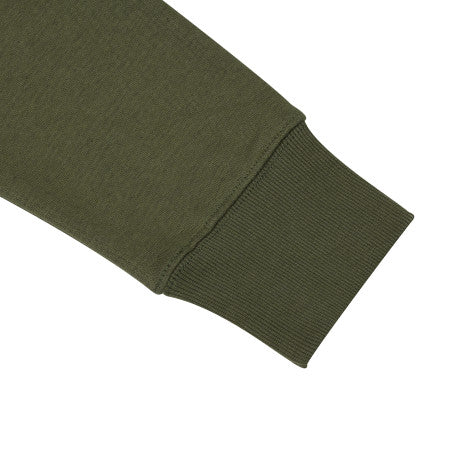 Close-up of a green fabric sleeve on a white background