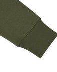 Close-up of a green fabric sleeve on a white background
