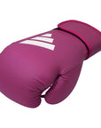 Pink boxing glove with white stripes, adidas FLX 3.0 Speed 50 for boxing and kickboxing.