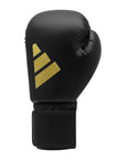 A black boxing glove with gold logo.