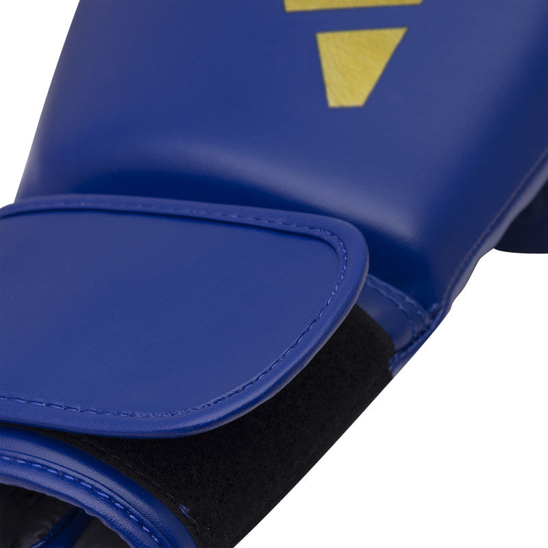 Blue boxing glove with a logo, adidas FLX 3.0 Speed 50 for boxing and kickboxing.