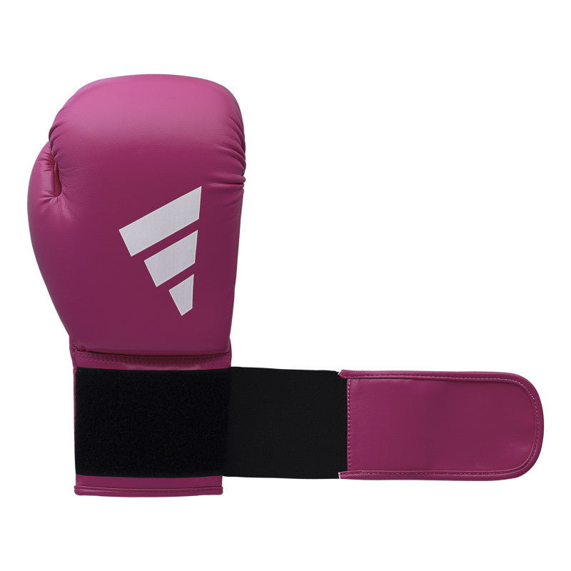 A pink boxing glove with a black strap, adidas FLX 3.0 Speed 50.