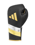 Black and gold adidas Adi-Speed 500 boxing glove.