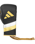 Black and gold adidas Adi-Speed 500 boxing glove.