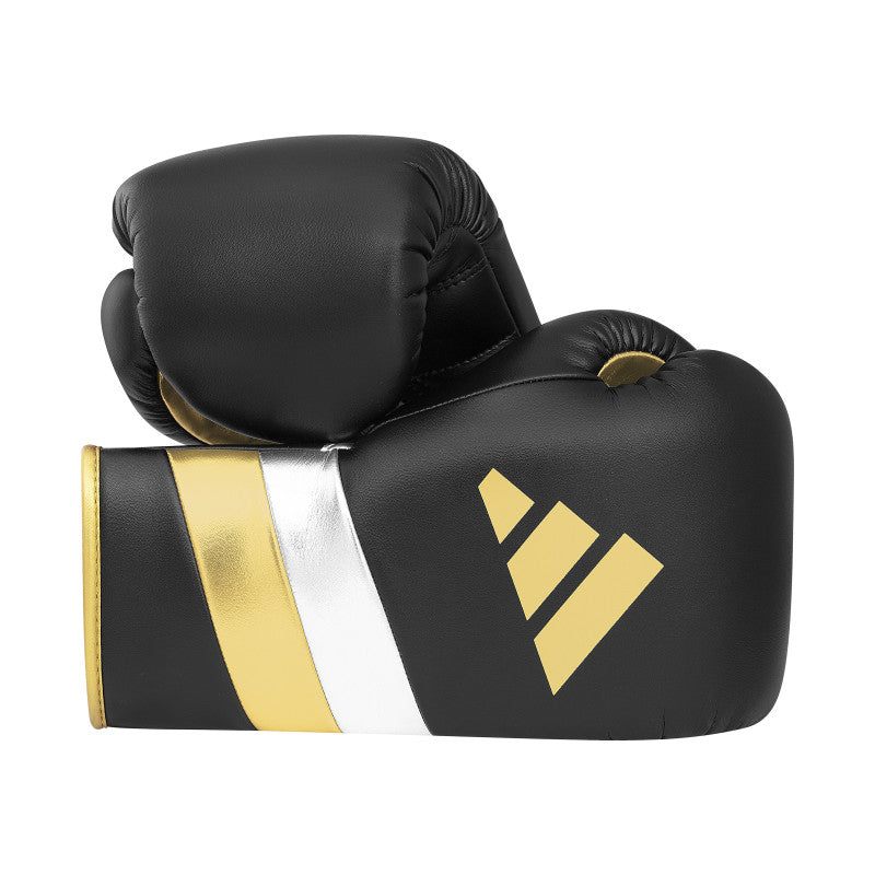 Pair of black and gold boxing gloves, Adidas Adi-Speed 500.