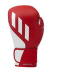 Red boxing glove with white accents on a white background