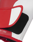 Close-up of a red and white golf club head cover with 'Speed Tilt 250' branding.