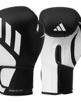 Black and white boxing gloves with Adidas logo on a white background