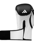 Black and white boxing glove with Adidas logo on a white background