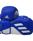 Blue boxing gloves with white Adidas logo on a white background