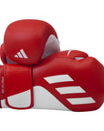 Red boxing gloves with white accents on a white background