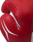 Close-up of a red boxing glove with white accents on a white background