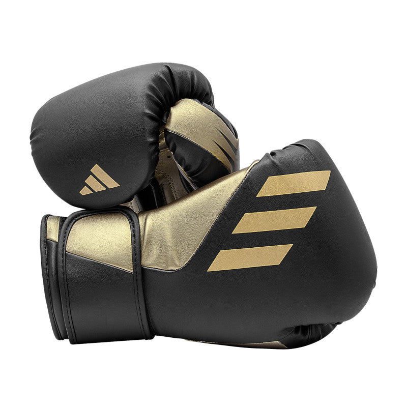 Black and gold Tilt 350 PRO training boxing gloves made from sustainable cactus leather.