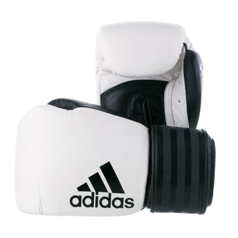 Pair of white and black boxing gloves by Adidas.