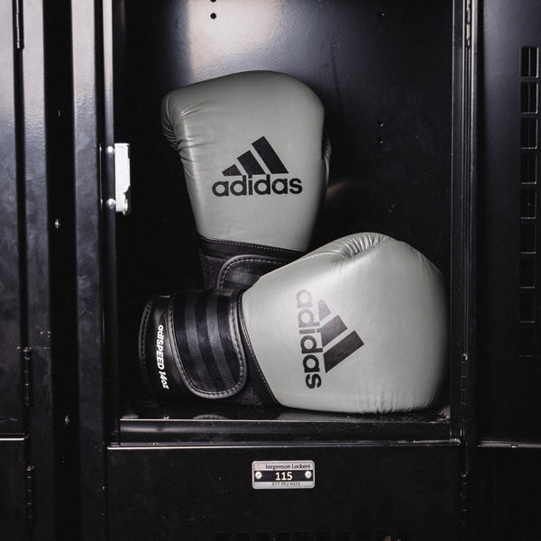 Pair of boxing gloves in a locker, adiSPEED 501 PRO edition.