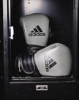 Pair of boxing gloves in a locker, adiSPEED 501 PRO edition.