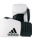 Pair of white and black boxing gloves by Adidas.