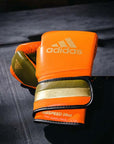 Orange boxing glove from adiSPEED 501 PRO collection.