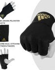 A hand wearing a glove designed for boxing training.