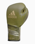 Green boxing glove with gold trim.