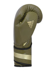 Green boxing glove with gold stripes, limited edition adiSPEED 501 PRO.