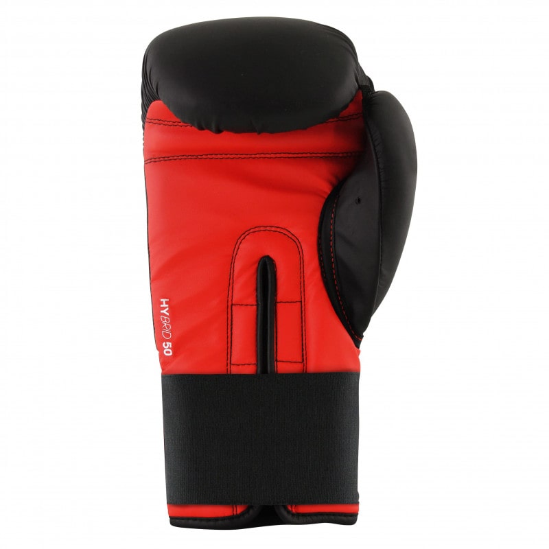 Red and black boxing glove, Adidas Hybrid 50 model.