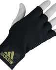 Black glove with yellow adidas logo for boxing.