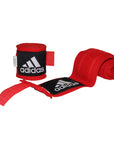 Red and black bandages for boxing hand protection.