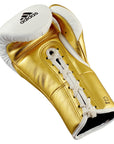 Gold adidas boxing glove with white laces.