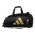 Black bag with a large gold Adidas logo.