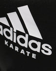 Close-up of black Adidas backpack designed for Karate training.