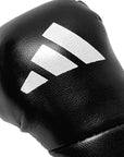 Black boxing glove with white stripes.