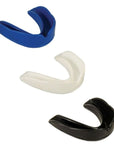 Set of different colored mouth guards made of thermoformable material.