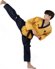 Man in a yellow taekwondo uniform with black belt.