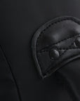 Close-up view of a black leather bag.