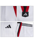 Close-up of a sports jersey with Adidas logo and design details on a white background