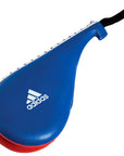 Blue and red Adidas punching bag for sparring gear.